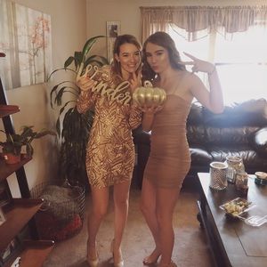 Long sleeve formal beaded dress.